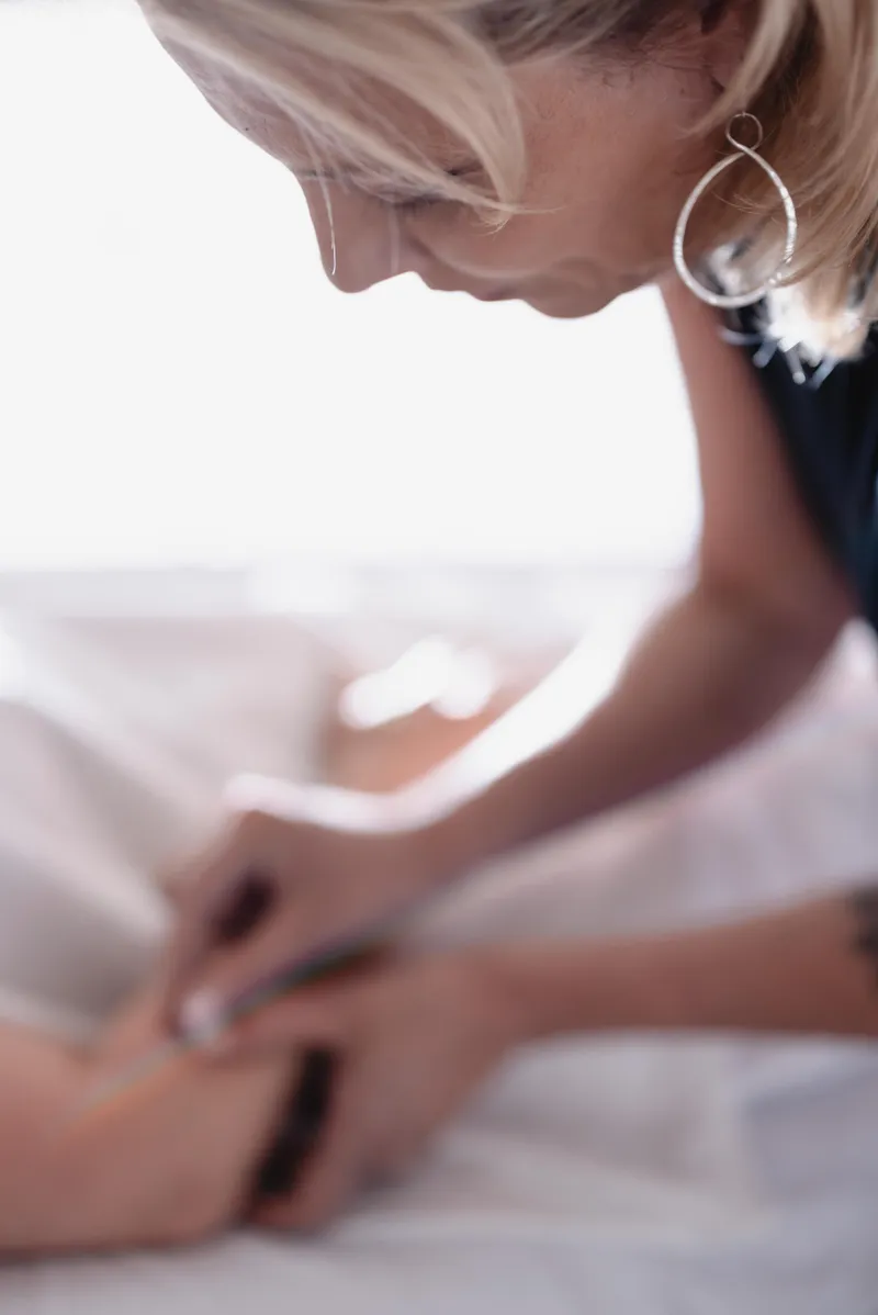 Maria providing acupuncture treatment